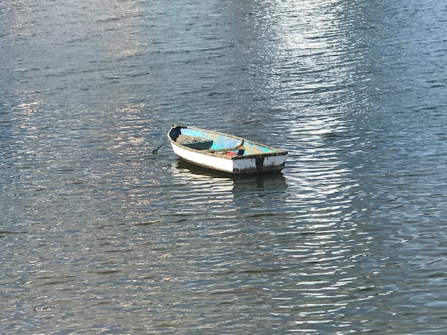 little old boat on water