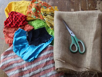 colourful fabric scraps, scissors and burlap