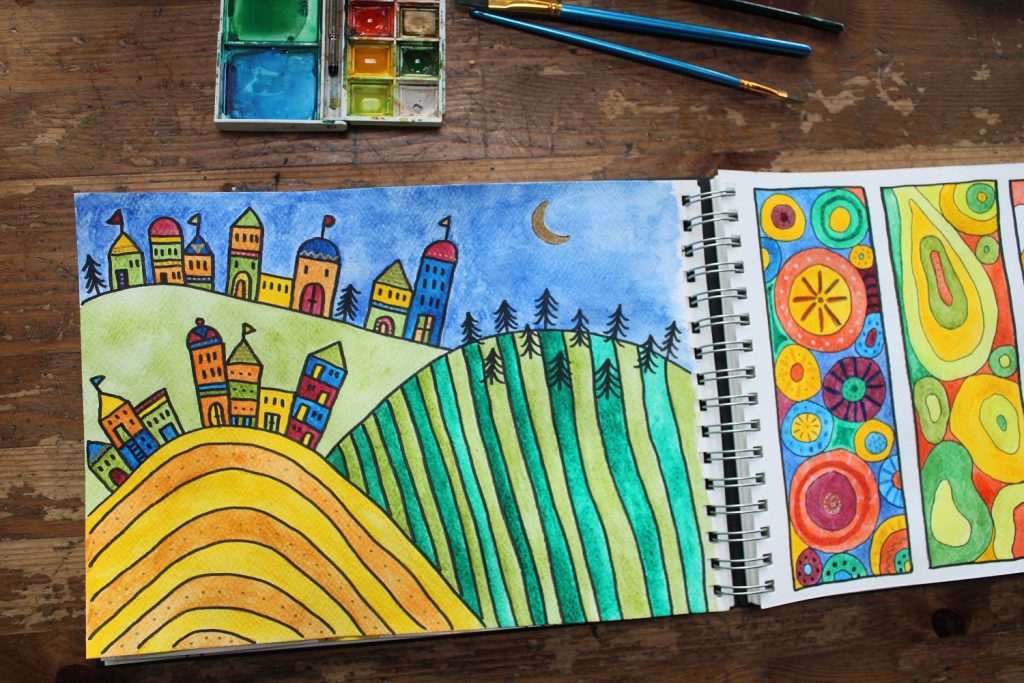 painted colourful houses and shapes in sketchbook