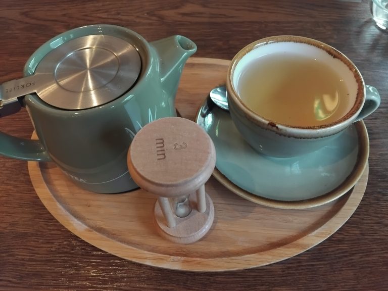 teapot and cup of tea on a tray