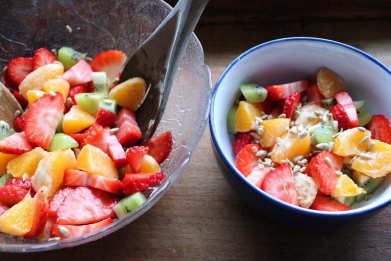 glass bowl and serving bowl with fruit salad